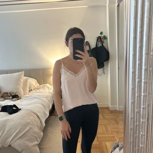 Light pink size small babaton aritzia tank top. Spaghetti straps. White lace.